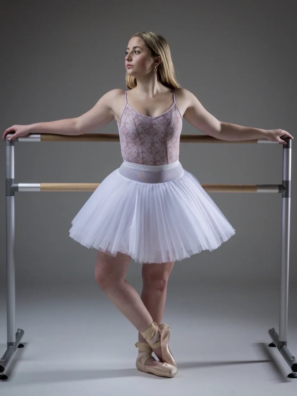 Aubry Travis at the ballet barre in a studio